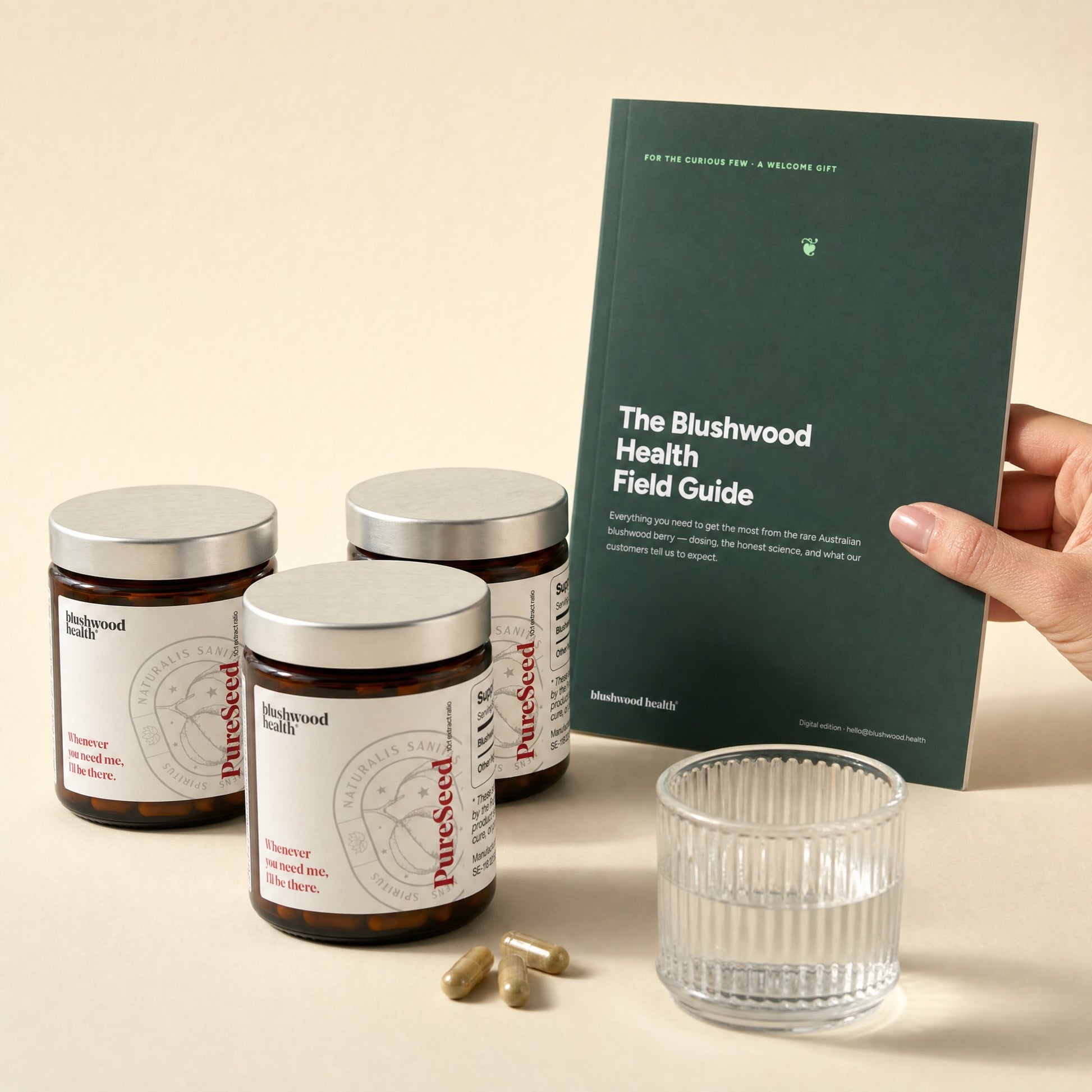 Capsules 3-pack — three jars (3-month supply) with the free Field Guide and a glass of water