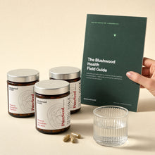 Capsules 3-pack — three jars (3-month supply) with the free Field Guide and a glass of water